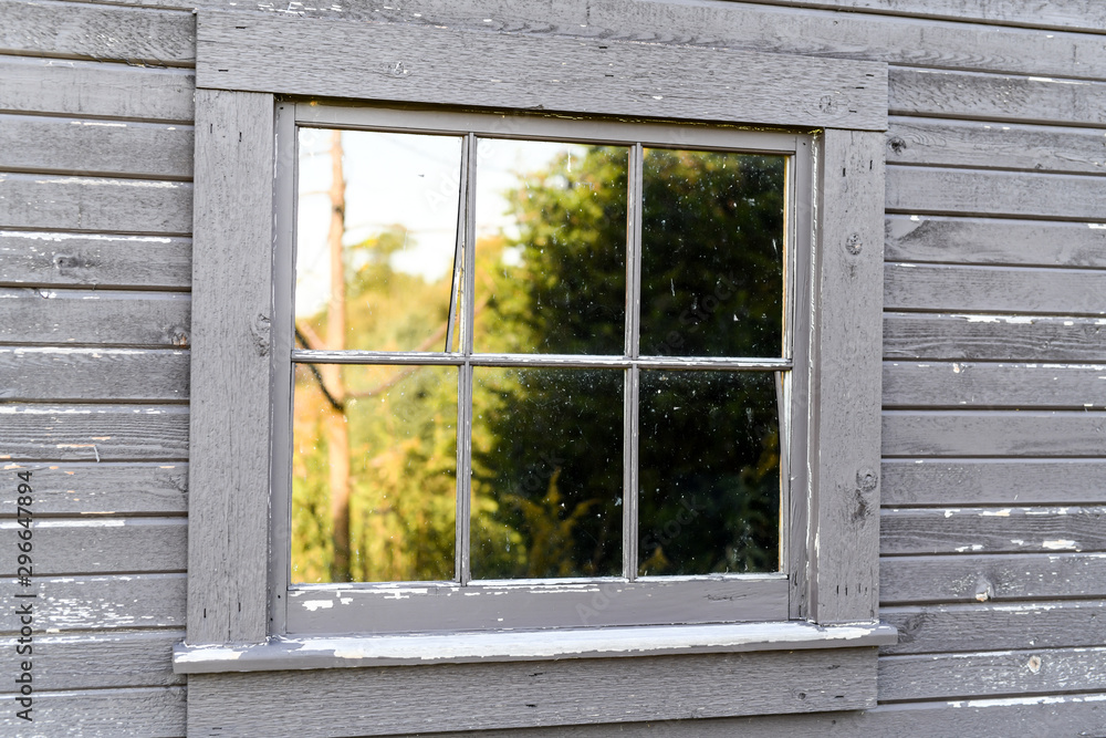 Fototapeta premium Old weathered wood barn farm window