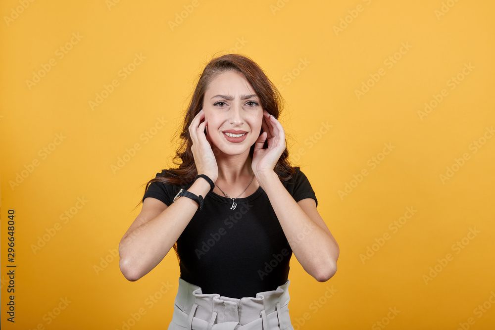 Beautiful lady trying to hear something as she is finding some trouble. She is also indicating as woman is feeling so noisy, so she wants someone to stop the noise. Beautiful lady trying to hear something as she is finding some trouble. She is also indicating as woman is feeling so noisy, so she wants someone to stop the noise.
