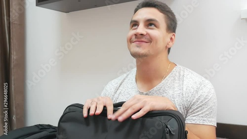 Attractive smiling man waiting for someone