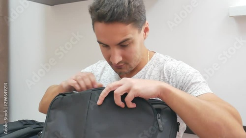Handsome man found something in a bag