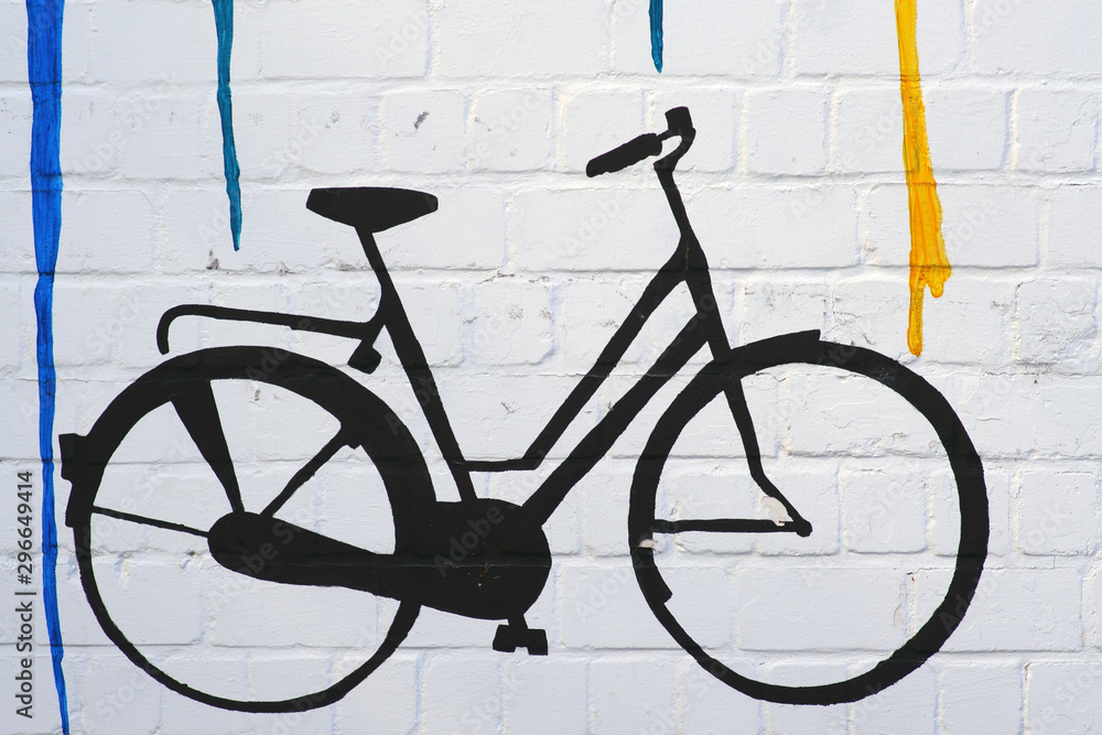 Die Zeichnung und der Umriss eines Fahrrades an einer Mauer mit Farbverläufen...