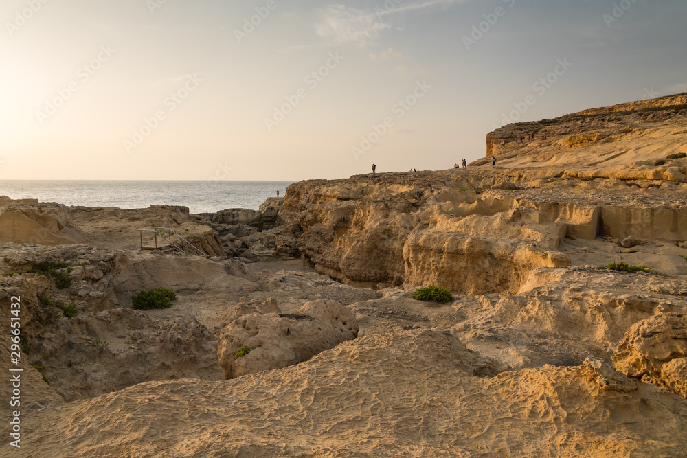 A Large Rocky Beach on the Island of Gozo at Sunset
