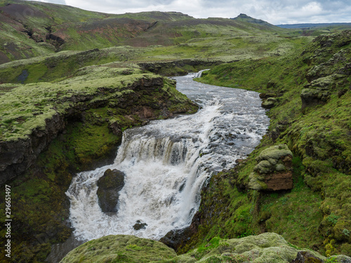 Beautifull waterfall on the Skoga River with rainbow and no people on famous Fimmvorduhals trail second part of Laugavegur trek. Summer landscape on a sunny day. Amazing in nature. August 2019, South photo