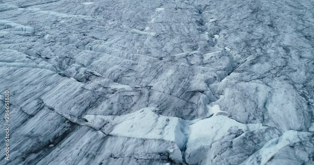 Aerial: low tracking shot of glacial crevices in Folgefonna glacier. Norway. Blue ice. Aerial: low tracking shot of glacial crevices in Folgefonna glacier. Norway. Blue ice.