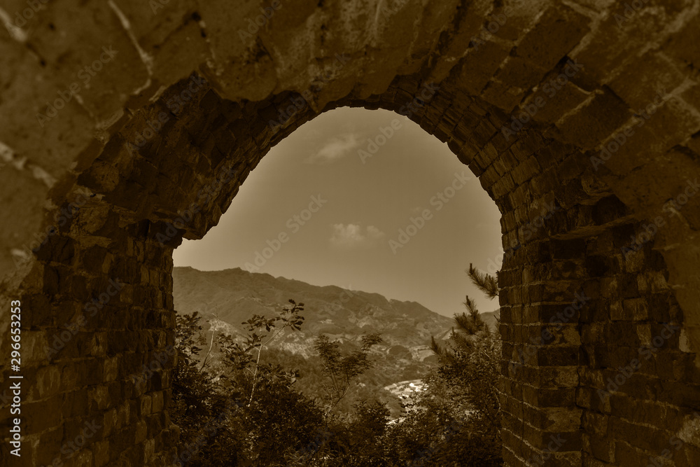 A close-up view of watchtower watchtower on the Great Wall, an ancient Chinese building, in yumuling, qianxi county, hebei province, China. Monochrome black and white, retro yellow creative