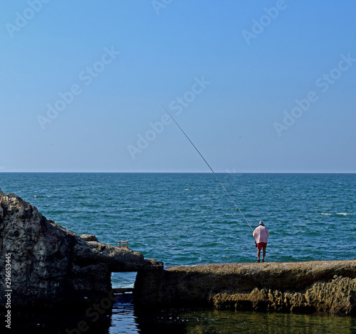 fisherman and the sea in the summer time