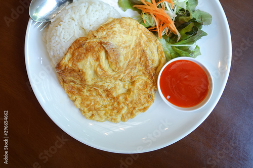 Thai style pork omelette on wood table