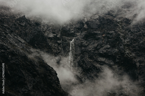 Zealand Waterfall Surrounded By Rock