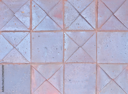 Background surface of regular ceramic tiles in square pattern.