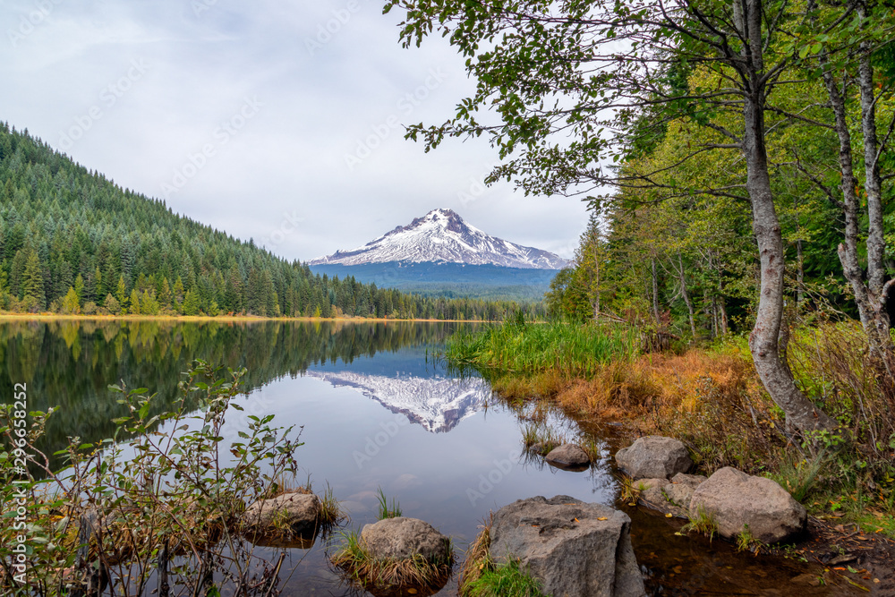 Mt. Hood reflecting in Trillium Lake with rocks and trees in an idyllic scene