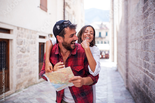 Happy love couple with map in a town © Novak