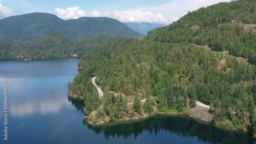 Aerial View at Mountain Lake with Blue Sky in British Columbia, Canada. 4K. Aerial View at Mountain Lake with Blue Sky in British Columbia, Canada. 4K.