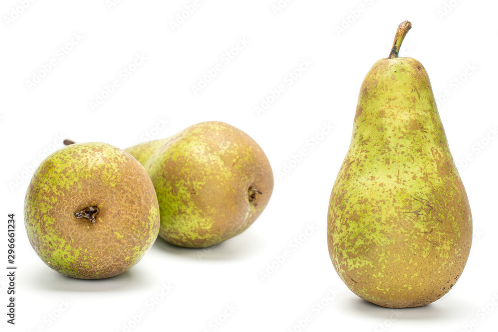 Group of three whole fresh green pear conference one in focus isolated on white background Group of three whole fresh green pear conference one in focus isolated on white background