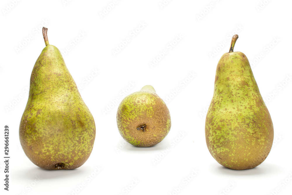 Group of three whole fresh green pear conference two in focus isolated on white background Group of three whole fresh green pear conference two in focus isolated on white background