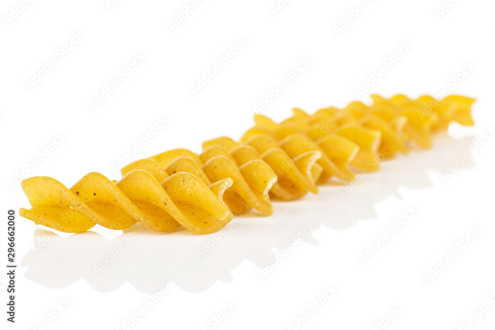 Lot of whole dry brown wholegrain fusilli isolated on white background Lot of whole dry brown wholegrain fusilli isolated on white background