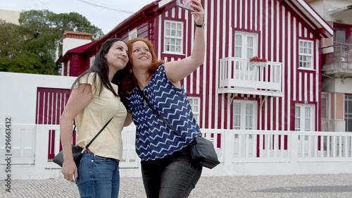 Two friends visit the village of Costa Nova in Portugal - travel photography