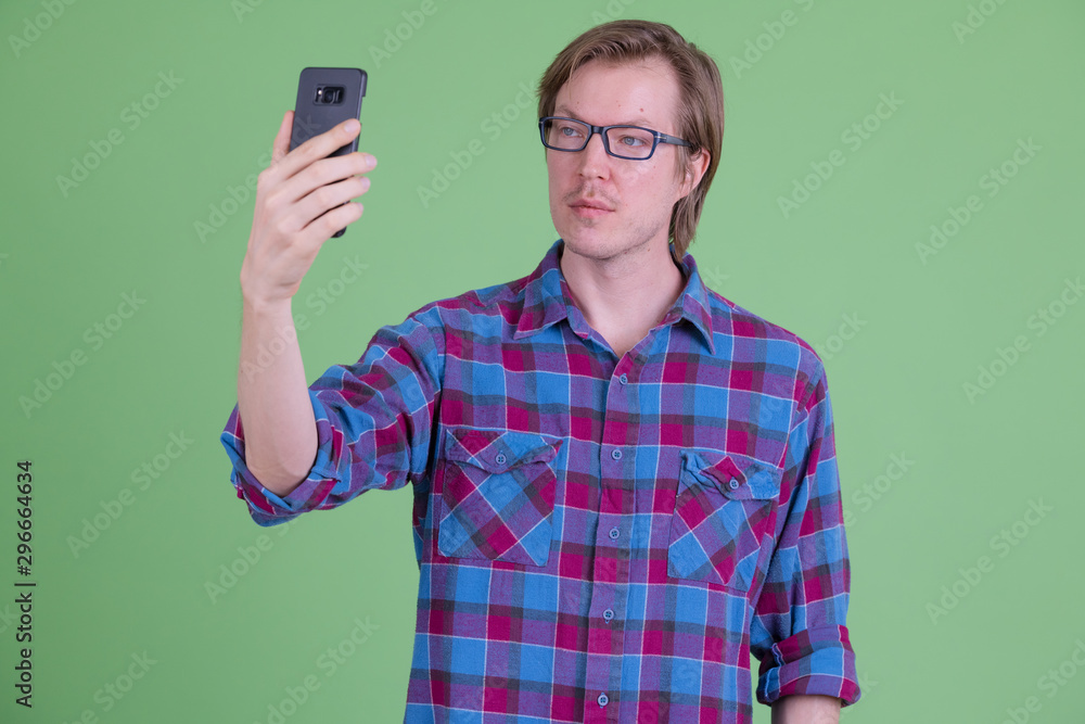 Young handsome hipster man with eyeglasses taking selfie Young handsome hipster man with eyeglasses taking selfie