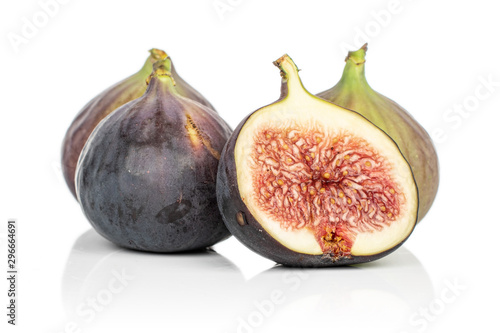 Group of three whole one half of sweet purple fig isolated on white background