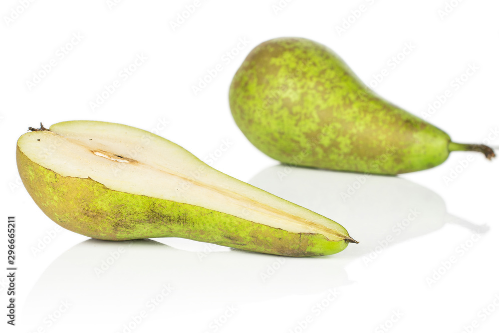 Group of one whole one half of fresh green pear isolated on white background Group of one whole one half of fresh green pear isolated on white background