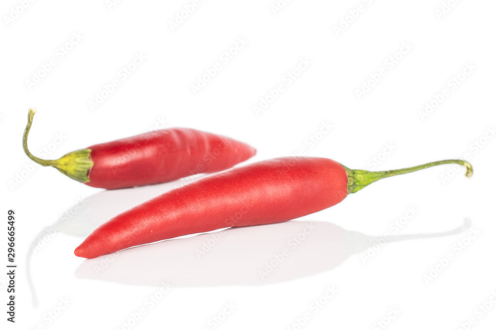 Group of two whole hot red chili cayenne isolated on white background