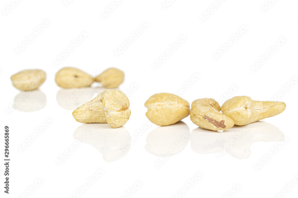 Lot of whole brown nut cashew front focus isolated on white background Lot of whole brown nut cashew front focus isolated on white background