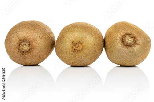Group of three whole exotic brown kiwi isolated on white background