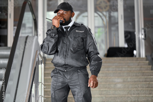 African-American security guard working in building