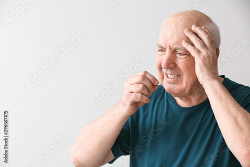 Elderly man taking medicine...
