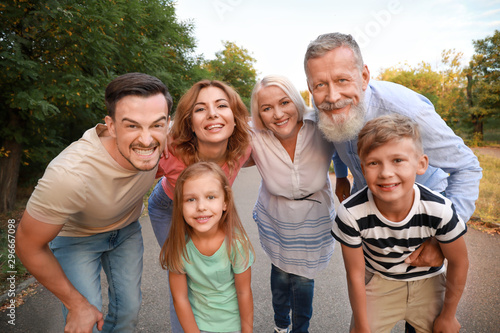 Happy family having fun in park photo