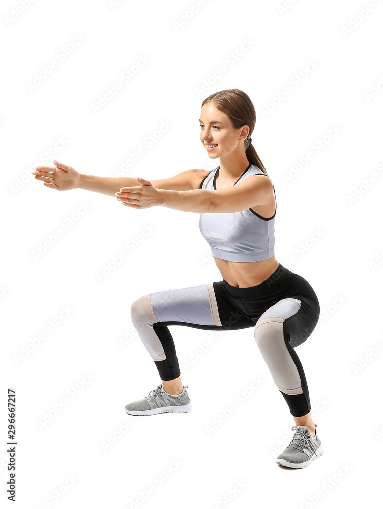Sporty young woman training against white background Sporty young woman training against white background