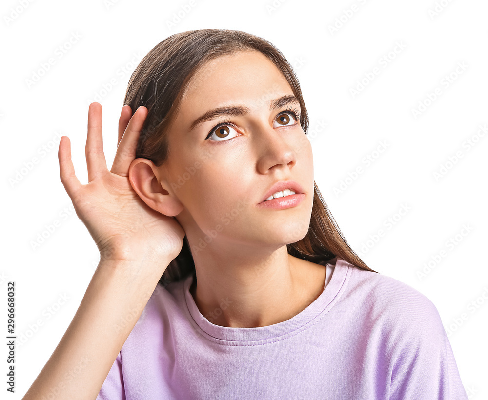 Young woman with hearing problem on white background Young woman with hearing problem on white background
