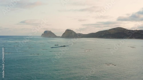 Sunset at the bay of the fishing village of Gerupuk, Lombok. Aerial shot. photo