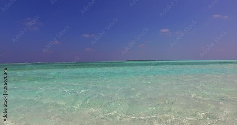 closeup view of small waves and ripples forming light rays on the sandy beach bottom in the Caribbean closeup view of small waves and ripples forming light rays on the sandy beach bottom in the Caribbean