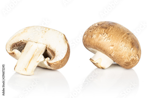 Group of one whole one half of fresh brown mushroom champignon isolated on white background