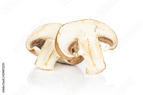 Group of one whole one slice of fresh brown mushroom champignon isolated on white background