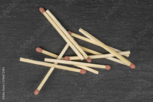 Obraz na plátne Lot of whole brown safety match flatlay on grey stone