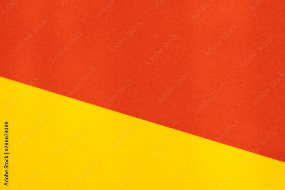 Yelllow red color paper background. Geometric figures, shapes. Abstract geometric flat composition. Empty space on monochrome cardboard. Yelllow red color paper background. Geometric figures, shapes. Abstract geometric flat composition. Empty space on monochrome cardboard.