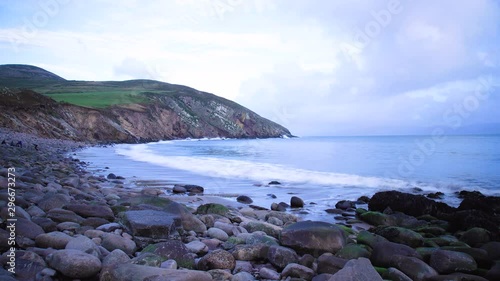 timelapse footage of the coastline in southern ireland on the dingle peninsula showing minard castle at sunset photo