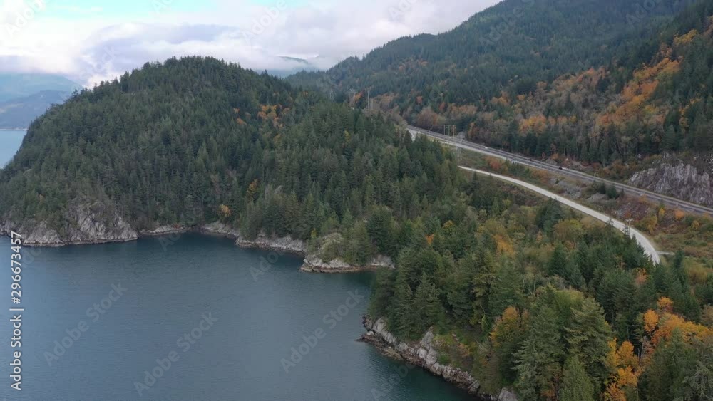 Aerial view over inlet, ocean and island with boat and mountains in beautiful British Columbia. Canada. 4K. Aerial view over inlet, ocean and island with boat and mountains in beautiful British Columbia. Canada. 4K.