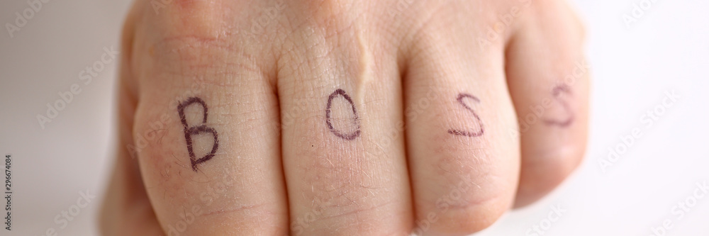 Male clenched fist in suit at office closeup Male clenched fist in suit at office closeup