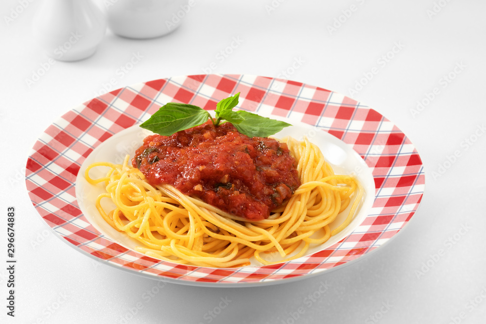 close up view of plate with spaghetti on white background. close up view of plate with spaghetti on white background.