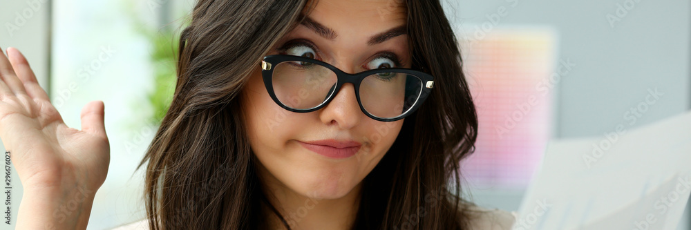 Young beautiful business woman holding glasses Young beautiful business woman holding glasses