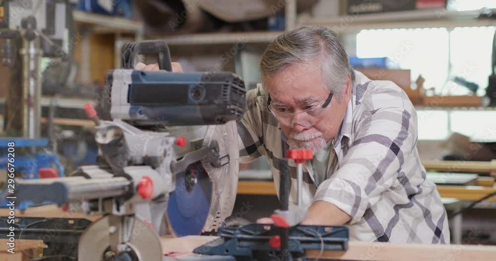 Professional carpenter working at workshop. 4K Resolution Professional carpenter working at workshop. 4K Resolution