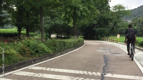 Wallpaper Mural Guy hiking on bicycle up to the mountain, Torontodigital.ca