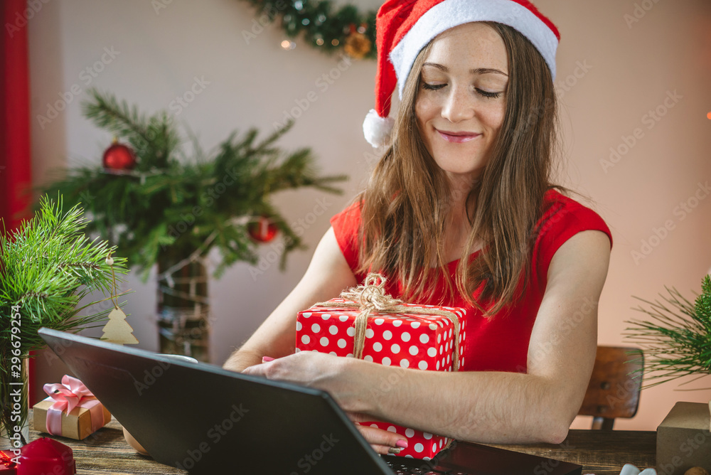 Beautiful woman holding a gift red box presented on Christmas eve for the New year. Emotional of receiving a gift Beautiful woman holding a gift red box presented on Christmas eve for the New year. Emotional of receiving a gift