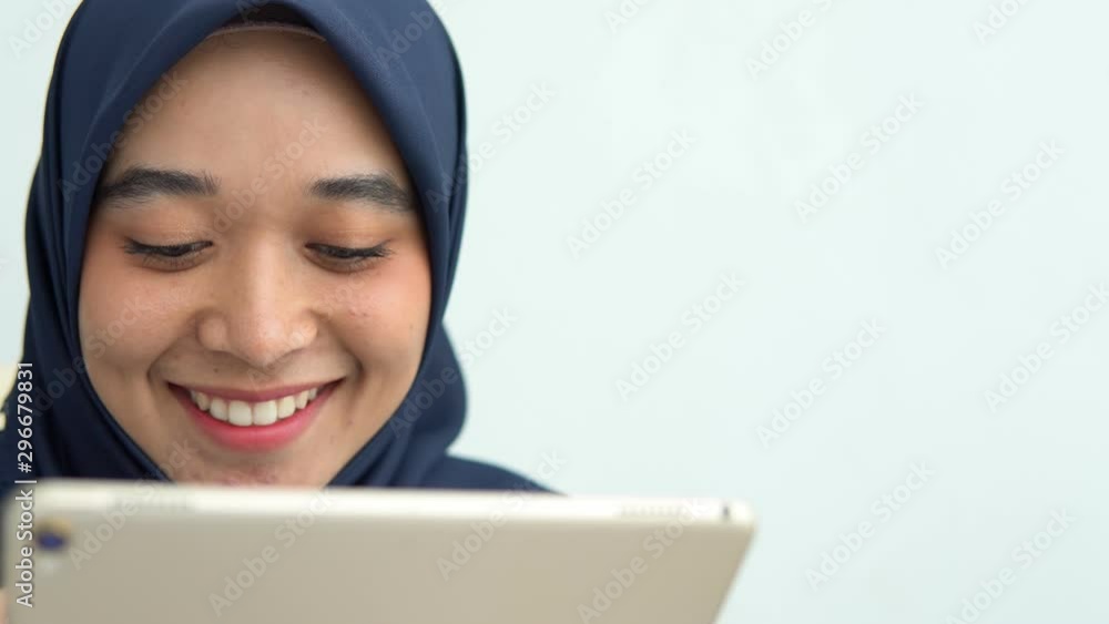 Young Muslim women Students is a creative freelance journalist sit writing to be entrepreneur job concept for hijab girl Islam religion Asian ethnic joyful internet banking on tablet mobile smartphone Young Muslim women Students is a creative freelance journalist sit writing to be entrepreneur job concept for hijab girl Islam religion Asian ethnic joyful internet banking on tablet mobile smartphone