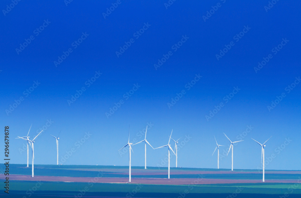 Wind turbines profiled on vlear sky in summer