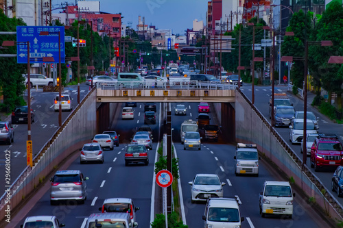 A downtown street at Kanpachi avenue in Tokyo daytime long shot photo