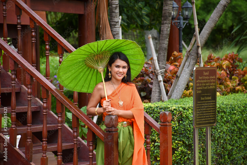 Traditional Thai, Siamese dresses, umbrellas and accessories in Mallika City R.E. 124, the heritage, retro Siamese village in Kanchanaburi