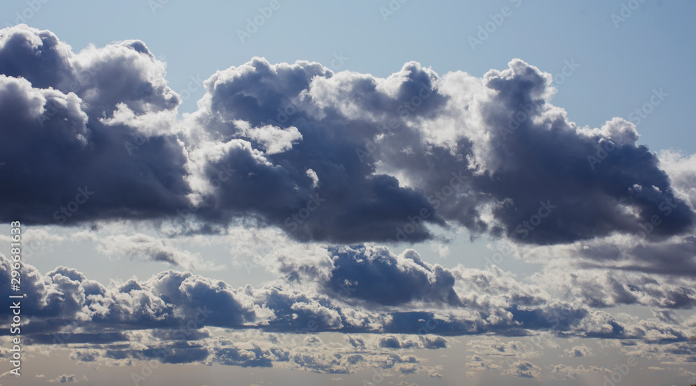 Landscape. Clouds in the blue sky illuminated by the sun Landscape. Clouds in the blue sky illuminated by the sun